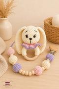 ring-shaped bunny rattle and pacifier holder